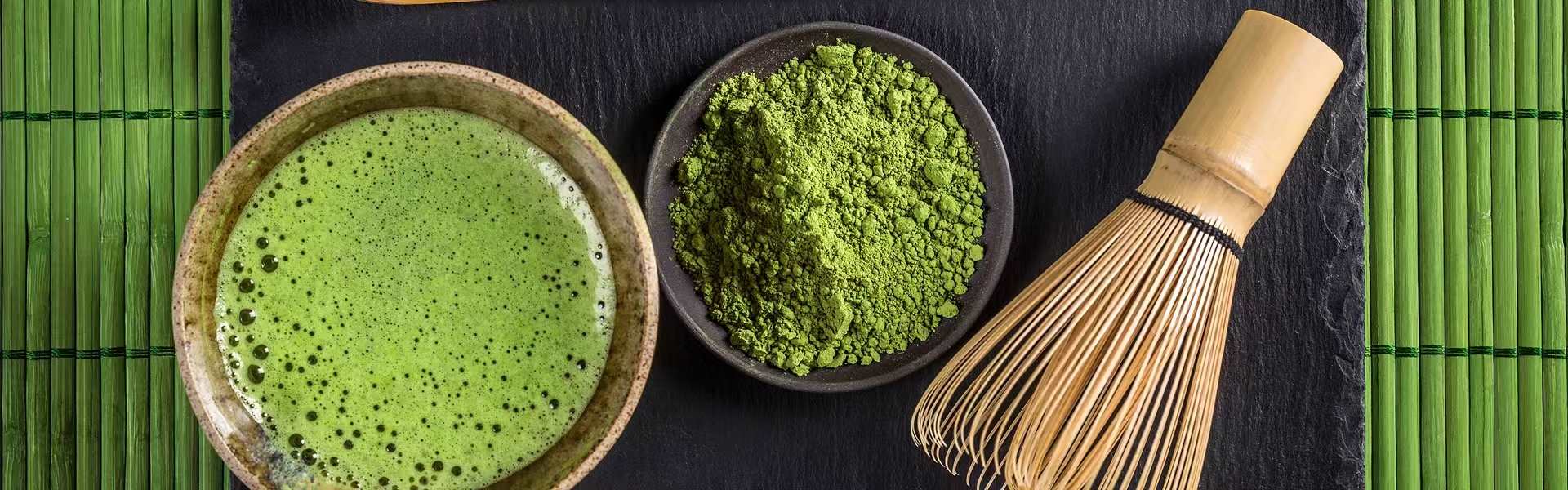 Whisked matcha with bamboo chasen and matcha powder